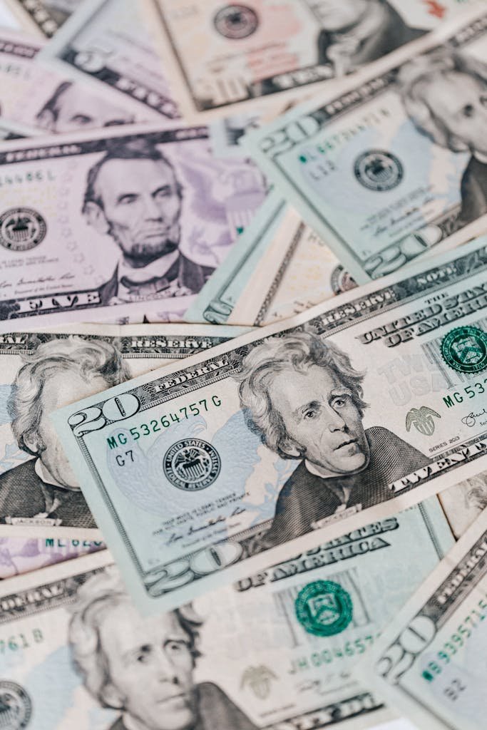 Detailed image of US dollar bills showcasing currency and wealth. Perfect for financial themes. 50/30/20 spending plan